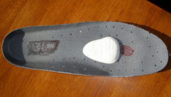 How do I fit a metatarsal pad 