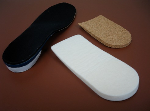 Heel lifts used in treating insertional Achilles tendonitis